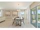 Dining area featuring bright natural light, comfortable chairs, and tile flooring at 1546 Park Leah Cir, Apopka, FL 32712