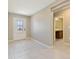 Bright entryway with tile flooring, a glass-paneled front door, and view to nearby bathroom at 1546 Park Leah Cir, Apopka, FL 32712