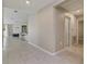 Hallway featuring neutral walls and tile flooring leading to the kitchen and living areas at 1546 Park Leah Cir, Apopka, FL 32712