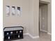 Hallway featuring neutral walls and tile flooring with bench seating at 1546 Park Leah Cir, Apopka, FL 32712