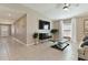 Living room with tile floors, a sleek entertainment center, and view towards the entry and kitchen at 1546 Park Leah Cir, Apopka, FL 32712