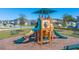 A well-maintained playground with slides, climbing structures, and benches in the Legacy Hills community at 1546 Park Leah Cir, Apopka, FL 32712