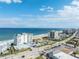 Scenic aerial view of the oceanfront condo complex with beach access and ocean views at 1575 Ocean Shore Blvd # 306, Ormond Beach, FL 32176