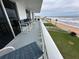 Enjoy ocean views from the balcony, featuring chairs and a table for relaxing and entertaining at 1575 Ocean Shore Blvd # 306, Ormond Beach, FL 32176