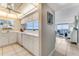 Well-lit kitchen featuring tiled floors, white countertops, and ocean views at 1575 Ocean Shore Blvd # 306, Ormond Beach, FL 32176