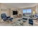 Comfortable living room with leather furniture, ocean view and light wood floors at 1575 Ocean Shore Blvd # 306, Ormond Beach, FL 32176