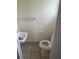 Simple bathroom with toilet, sink, and tile floor at 1606 26Th St, Orlando, FL 32805