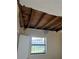 View of an interior room featuring ceiling damage and a window at 1606 26Th St, Orlando, FL 32805