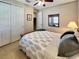 Comfortable bedroom with a ceiling fan, closet, and plenty of storage space at 172 Balmy Coast Rd, Groveland, FL 34736