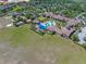 Aerial view of the community pool and recreation center, complete with pools, canopies, and lounge areas at 172 Balmy Coast Rd, Groveland, FL 34736