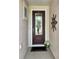 Front entryway featuring a decorative door, textured walls and ornate wall decor at 172 Balmy Coast Rd, Groveland, FL 34736