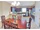 Kitchen and dining area with stainless steel appliances and granite countertops at 172 Balmy Coast Rd, Groveland, FL 34736