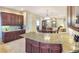 Bright kitchen featuring granite countertops and tile floors at 172 Balmy Coast Rd, Groveland, FL 34736