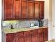 Kitchen featuring granite countertops and tile backsplash at 172 Balmy Coast Rd, Groveland, FL 34736