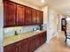 Kitchen featuring granite countertops, rich wood cabinets and views to other living spaces at 172 Balmy Coast Rd, Groveland, FL 34736