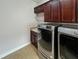 Laundry Room with new stainless steel washer and dryer at 172 Balmy Coast Rd, Groveland, FL 34736