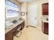 Comfortable office with desk, printer, and cabinets at 172 Balmy Coast Rd, Groveland, FL 34736