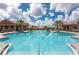 A sparkling community pool showcasing its ample swimming area and inviting lounge chairs at 172 Balmy Coast Rd, Groveland, FL 34736