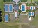 Overhead shot of the tennis courts, bocce ball and shaded seating area, perfect for active residents at 172 Balmy Coast Rd, Groveland, FL 34736