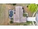 Aerial view of a home with a screened-in pool and well-maintained yard at 1739 Nectarine Trl, Clermont, FL 34714