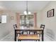 Cozy dining room with ample seating, natural light, and tile floors for easy maintenance at 1739 Nectarine Trl, Clermont, FL 34714