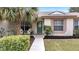 Inviting front porch with seating, lush landscaping, and a charming green front door at 1739 Nectarine Trl, Clermont, FL 34714