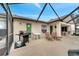 Outdoor patio with a barbecue, chairs, and a table located next to a screened-in pool at 1739 Nectarine Trl, Clermont, FL 34714