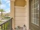 Cozy covered balcony featuring neutral paint, dark trim, and decorative accessories at 2041 Lobelia Dr, Lake Mary, FL 32746