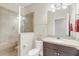 Well-lit bathroom featuring a tiled shower, modern vanity, and neutral wall color at 2041 Lobelia Dr, Lake Mary, FL 32746