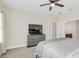 Spacious bedroom featuring a TV, dresser, and neutral walls complemented by soft carpeting at 2041 Lobelia Dr, Lake Mary, FL 32746