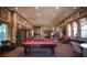 A large billiard room with a pool table, seating, and ample lighting at 2041 Lobelia Dr, Lake Mary, FL 32746