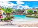 A beautiful pool area with lounge chairs and palm trees at the community center at 2041 Lobelia Dr, Lake Mary, FL 32746