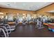 A spacious fitness center with modern exercise equipment and mirrored walls at 2041 Lobelia Dr, Lake Mary, FL 32746