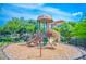 Community playground area featuring modern equipment and a secure fenced perimeter at 2041 Lobelia Dr, Lake Mary, FL 32746