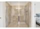 Modern shower with a glass door, tiled walls, and convenient built-in shelving at 2041 Lobelia Dr, Lake Mary, FL 32746