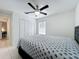 Bright bedroom with a ceiling fan, large window, and a comfortable bed at 2229 Churchill Downs Cir, Orlando, FL 32825