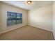 Bedroom featuring carpet, neutral walls, and a window with blinds at 240 Whispering Pines Way, Davenport, FL 33837