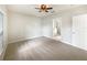 Spacious bedroom featuring a neutral color scheme, a ceiling fan, and an ensuite bathroom at 240 Whispering Pines Way, Davenport, FL 33837