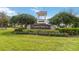 Beautiful community sign for Cypress Reserve surrounded by lush landscaping and manicured lawn at 2865 Eastham Ln, Kissimmee, FL 34741