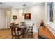 Formal dining room featuring a chandelier, decorative painting and classic wood furniture at 2865 Eastham Ln, Kissimmee, FL 34741