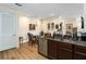 Bright kitchen with stainless steel sink, decorative backsplash, and an adjacent dining area at 2865 Eastham Ln, Kissimmee, FL 34741