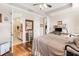 Main bedroom leading to bathroom, featuring hardwood floors, and elegant fixtures at 2865 Eastham Ln, Kissimmee, FL 34741