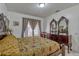 Bedroom features a large carved wooden dresser and ornate accent mirrors at 372 Aylesbury Ct, Kissimmee, FL 34758