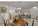 Open floor plan displaying the dining area flowing into the living room and kitchen at 372 Aylesbury Ct, Kissimmee, FL 34758