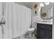 Bathroom featuring modern fixtures, patterned tile flooring and a shower with curtain at 4216 Kildaire Ave, Orlando, FL 32812