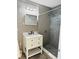 Bathroom with gray toned tile and a stylish sink and mirror at 423 Ololu Dr, Winter Park, FL 32789