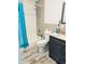 Bathroom with gray-toned tile and a blue shower curtain at 423 Ololu Dr, Winter Park, FL 32789