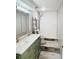 A bathroom featuring modern fixtures, double sinks, tiled floor and walk in shower at 423 Ololu Dr, Winter Park, FL 32789