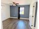 Bedroom featuring a ceiling fan, window and closet, with updated flooring at 423 Ololu Dr, Winter Park, FL 32789