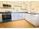 This kitchen features tile floors, granite counters and stainless steel appliances at 430 Pennsylvania Ave, Winter Garden, FL 34787